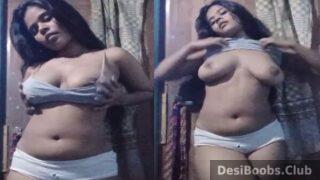 Sexy college girl stripping to show hot boobs